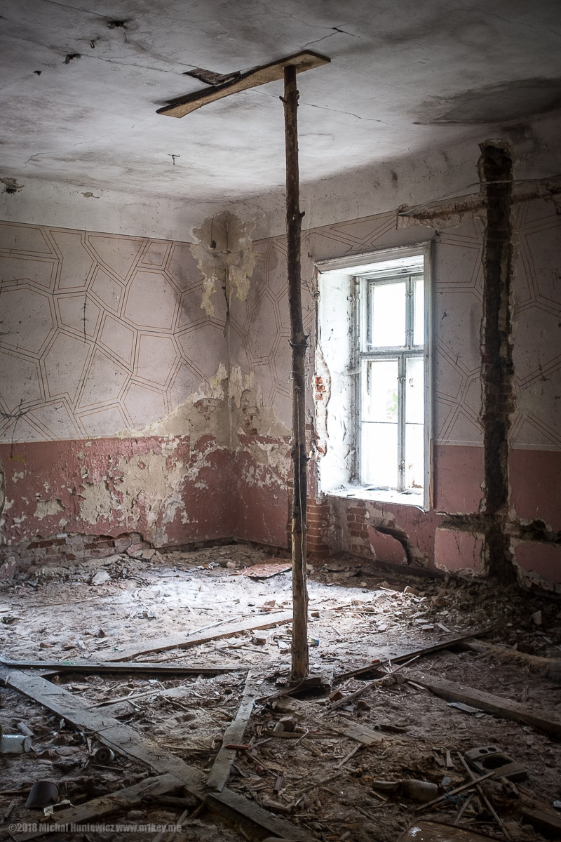 Building Held in Place By a Log of Wood